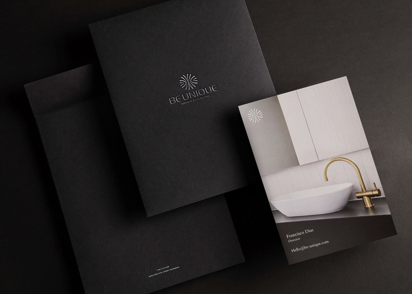Be Unique identity applied across a presentation folder and business card