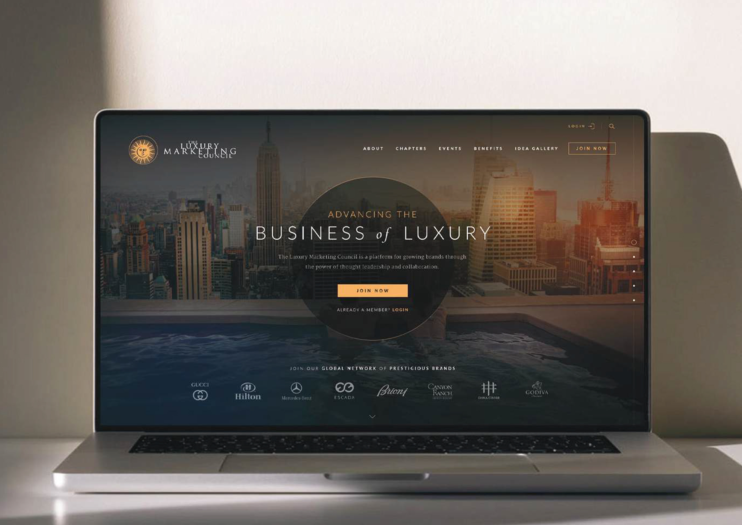 Luxury Marketing Council homepage displayed on a laptop